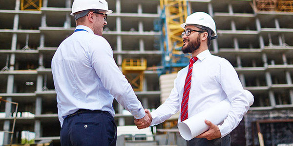  image showing an engineer and his client finalizing on the terms of appointment 