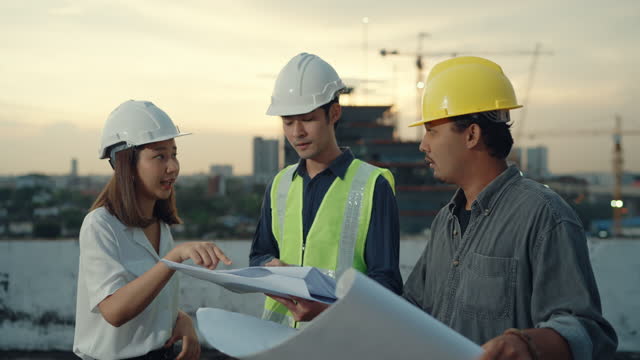 engineers on site discussing fee proposals.