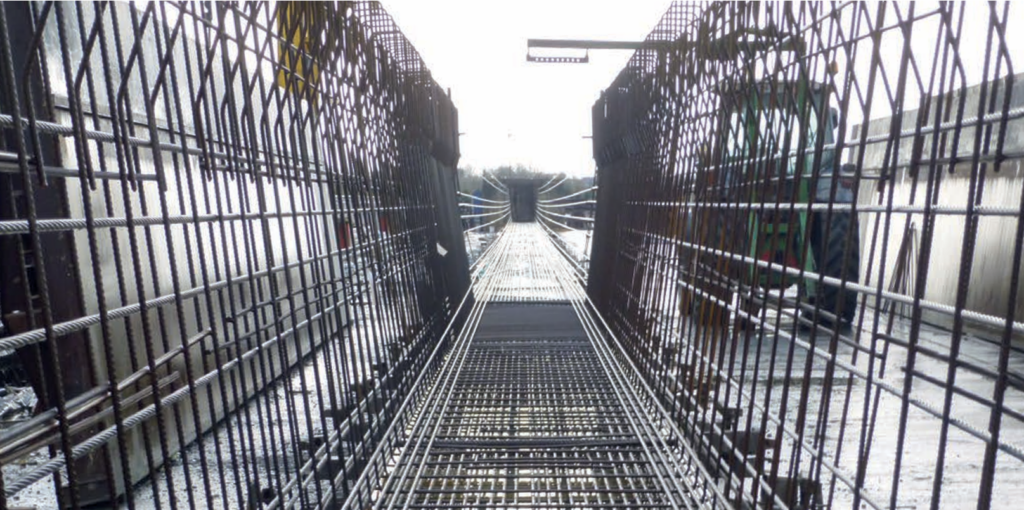 image is showing the pretensioning of a precast bridge deck 