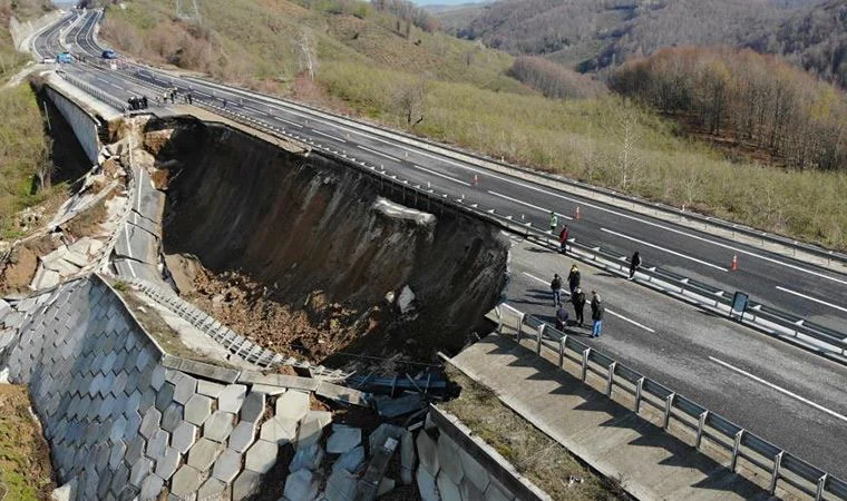 image showing a catastrophic retaining wall failure along a highway